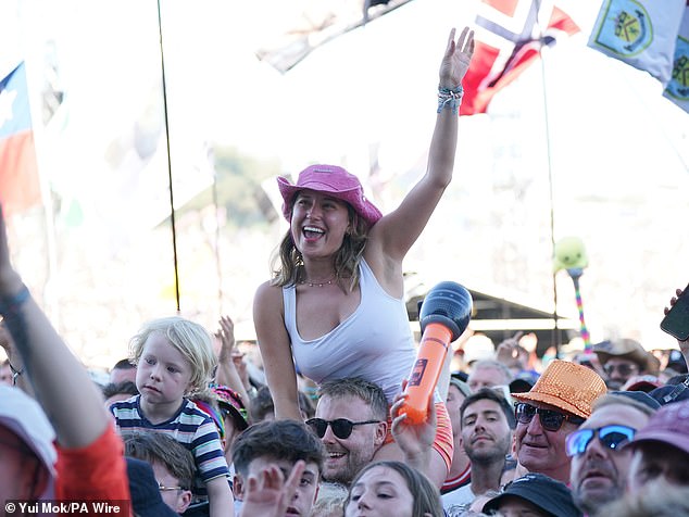 The singer-songwriter struggled to complete his Glastonbury performance on the same stage in 2023 after he was hit by a Tourette¿s attack - but the audience (above) lent him vocal support
