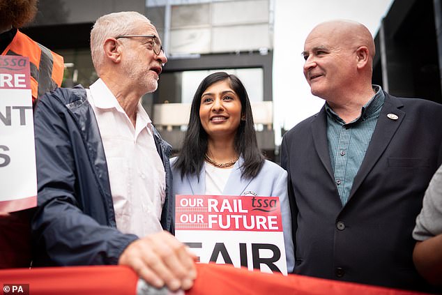 In the months leading up to the wedding, when the pair were living together in London , Corbynista Ms Sultana (centre) accepted a £10,000 donation from the union for her re-election campaign (Pictured with Jeremy Corbyn and Mick Lynch)