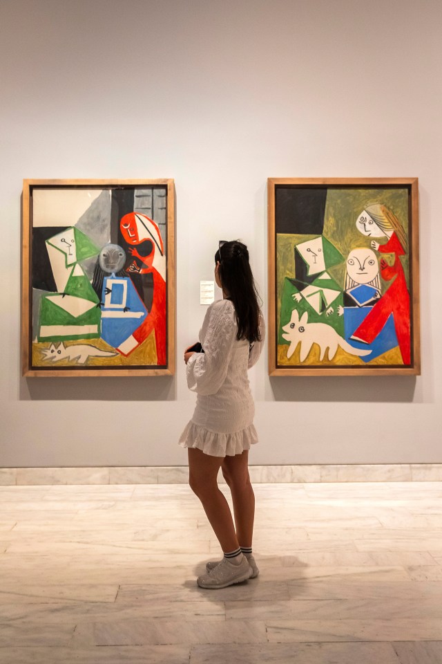 Person viewing Picasso paintings at the Picasso Museum in Barcelona.