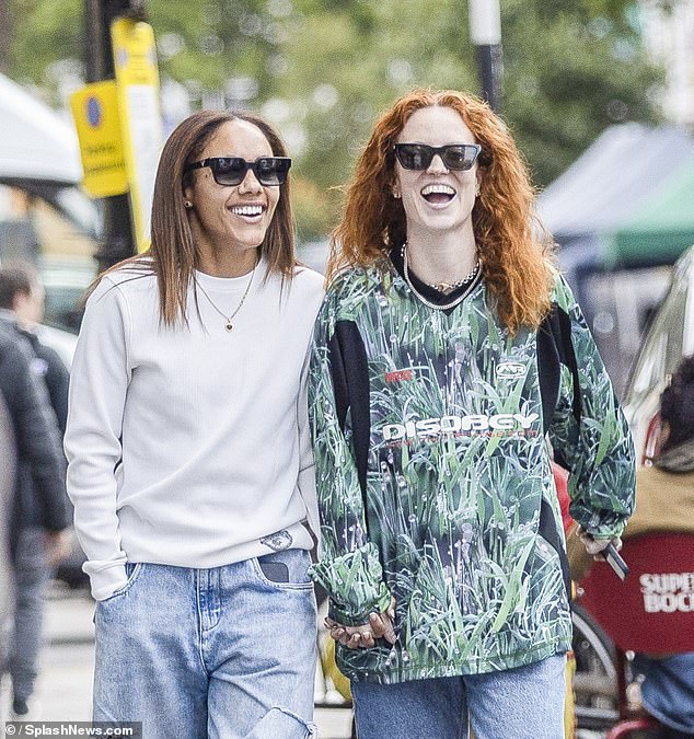 Meanwhile Alex cut a relaxed look for the outing in a cream fitted jumper and a pair of baggy blue mom jeans