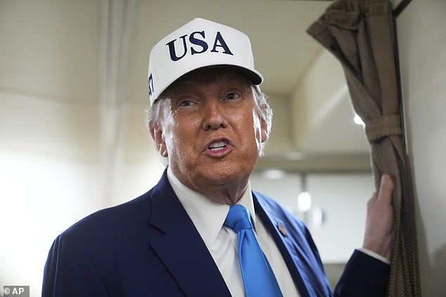 On Thursday, Trump threatened to cut off billions in government contracts to Musk's companies. He doubled down on Friday aboard Air Force One (pictured)