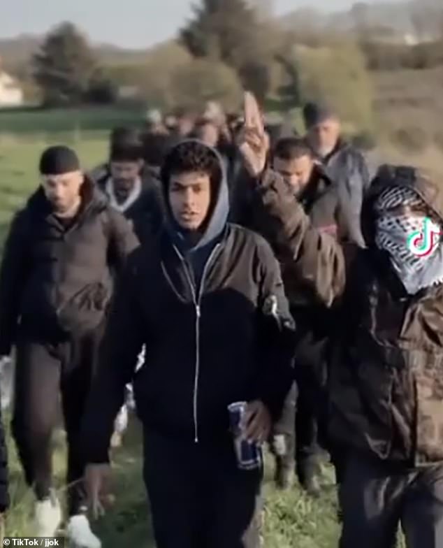 Pictured: a group of people believed to be migrants heading to a beach ahead of their journey. It comes as France is reportedly poised to demand millions of pounds in extra cash to help intercept Channel migrants