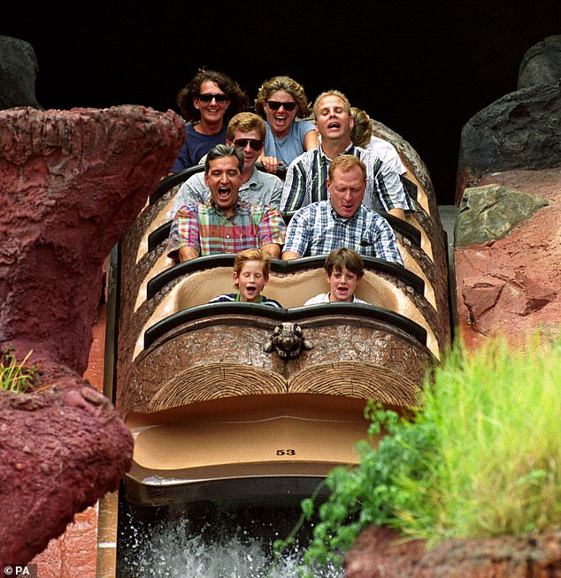 Prince Harry on the Splash Mountain log flume at Disney's Magic Kingdom. Princess Diana is leaning forward, hidden on the top row at the right
