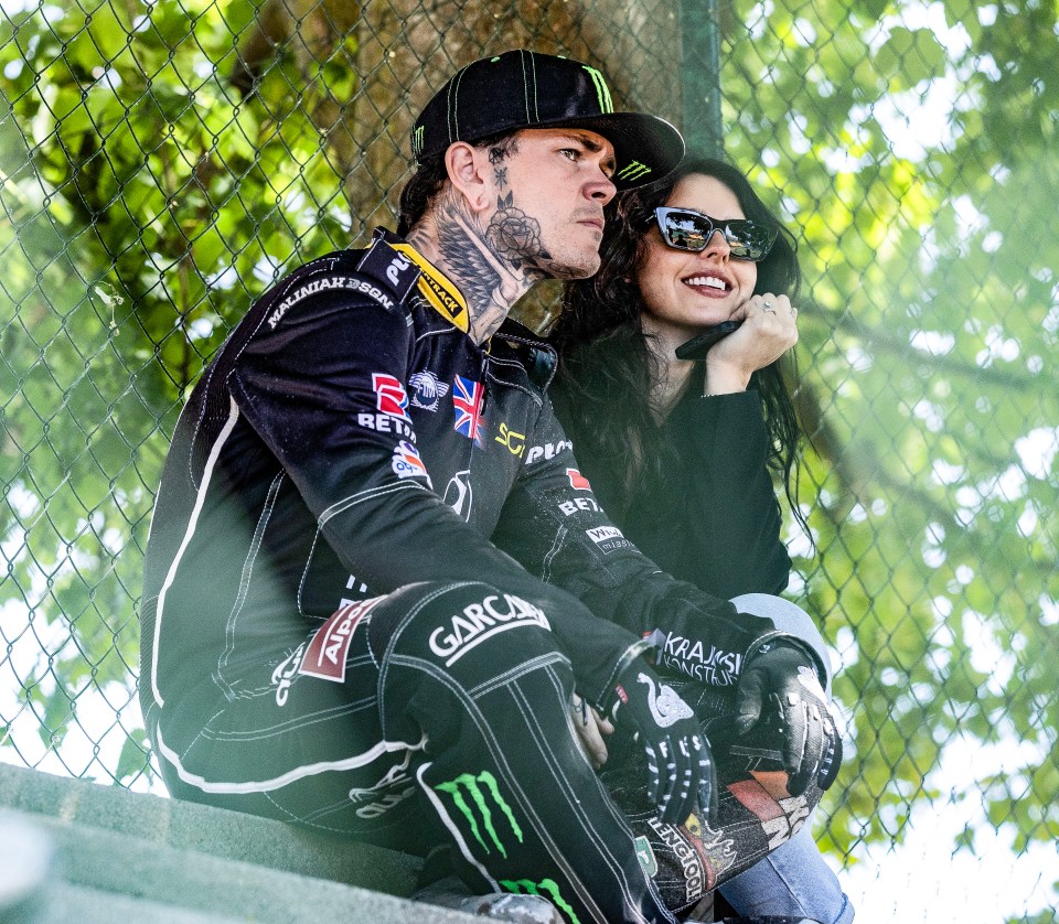 A man and woman sitting together.
