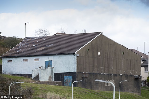 Homes built in the late 1960s as part of a 'modern council housing development' have been left to rot and are black-stained