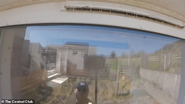 One empty home is infested with blue bottle flies, which crawl all over the grimy windows