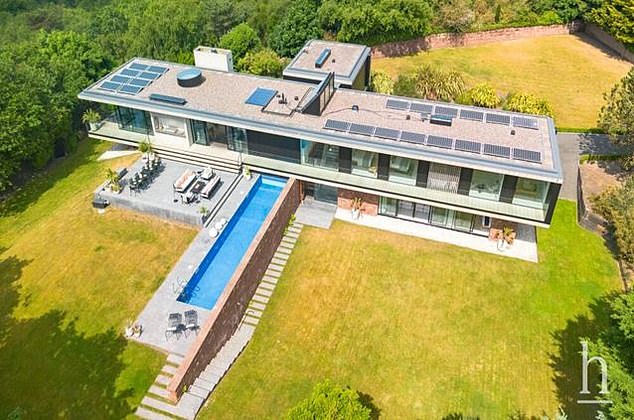 The spectacular six-bed Hollywood-style mansion in Wirral features spectacular coastal views as well as a heated outdoor swimming pool