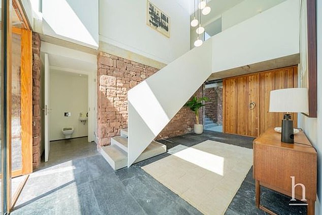 The lobby of the home perfectly captures its sleek interior and modern design