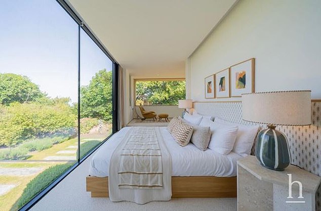 The ground floor features a luxurious double bedroom with stunning views of the countryside