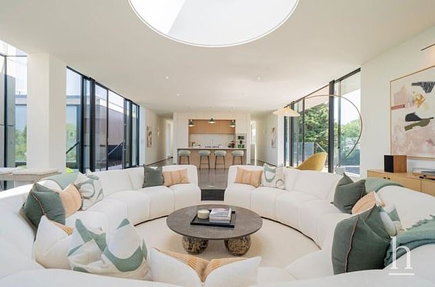 The first floor provides an open plan living and dining space area, featuring a show-stopping sunken sofa