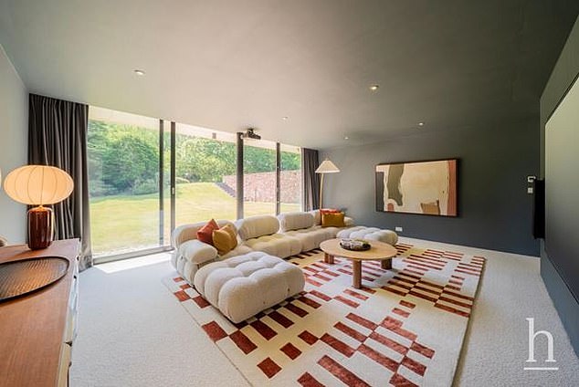 The house features a huge living room area, equipped with a huge flat screen TV