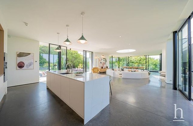 Inside the house there is a spacious, bespoke kitchen complete with quartz worktops