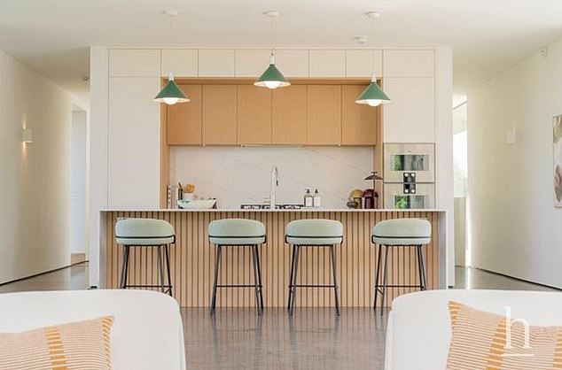 There is also a breakfast island equipped with comfy bar stools
