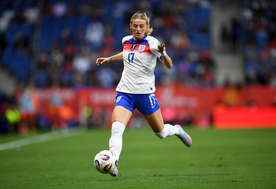 Chloe Kelly of England running with the ball during a soccer match.