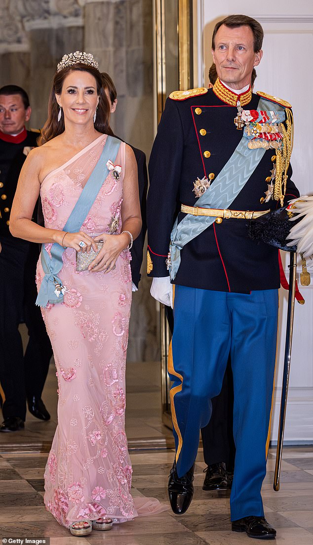 Prince Joachim and his wife Princess Marie, pictured here in 2023 attending a palace event, admitted to harbouring 'complicated' feelings after their children's royal titles were stripped
