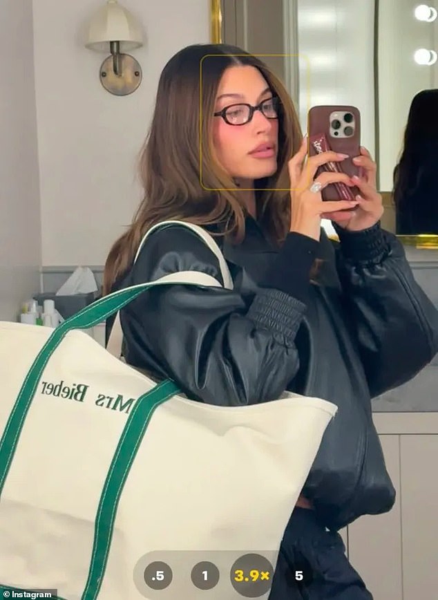 Hailey Beiber poses with an LL Bean tote bag