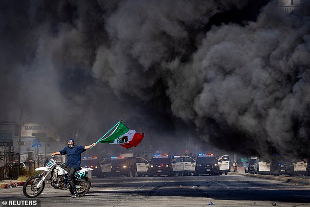 Tear gas and smoke filled the air as confrontations between immigration authorities and demonstrators extended into a second day