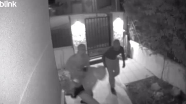 CCTV shows three thugs jumping over the back wall and into someone's home