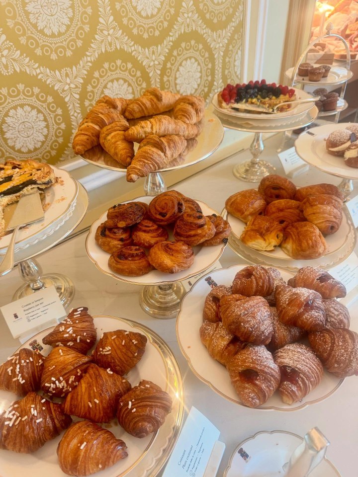 Assortment of pastries, including croissants, pain au chocolat, and other baked goods.