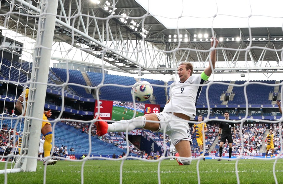 Harry Kane scoring a goal for England.