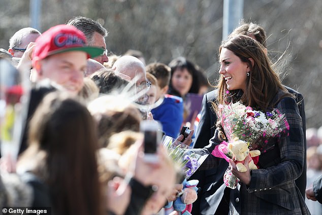 Kate greets the crowd as she visits the Donald Dewar Leisure Centre to launch a new project for their foundation in April 2013 in Glasgow