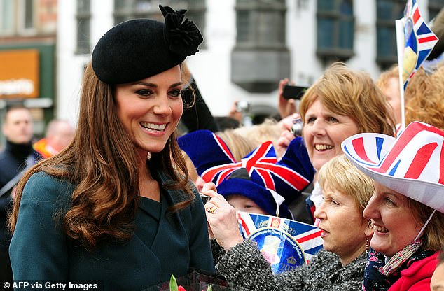The Princess of Wales is pictured chatting to cheering crowds  in Leicester in March, 2012