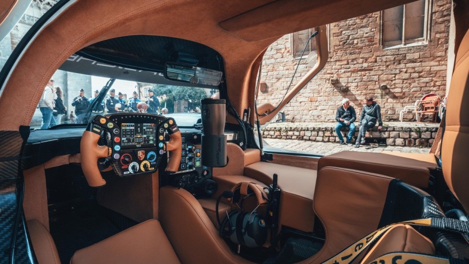 Interior view of a Porsche 963 RSP race car.