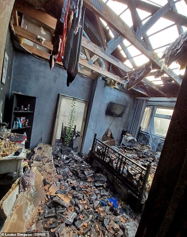 But after being released the following day without charge, West returned and set her porch ablaze before the flames quickly engulfed the entire house (aftermath of the fire pictured)