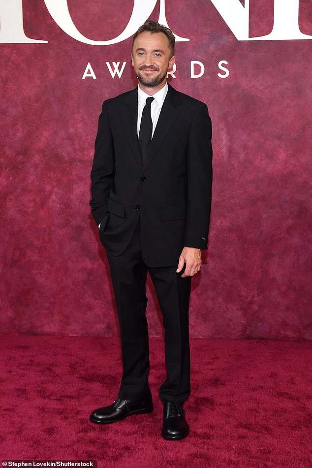 Tom Felton looked dapper in his suit and tie
