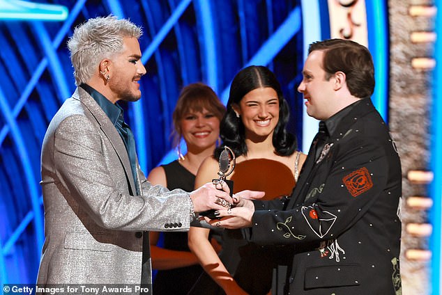 He received the award from Adam Lambert and Charli D'Amelio