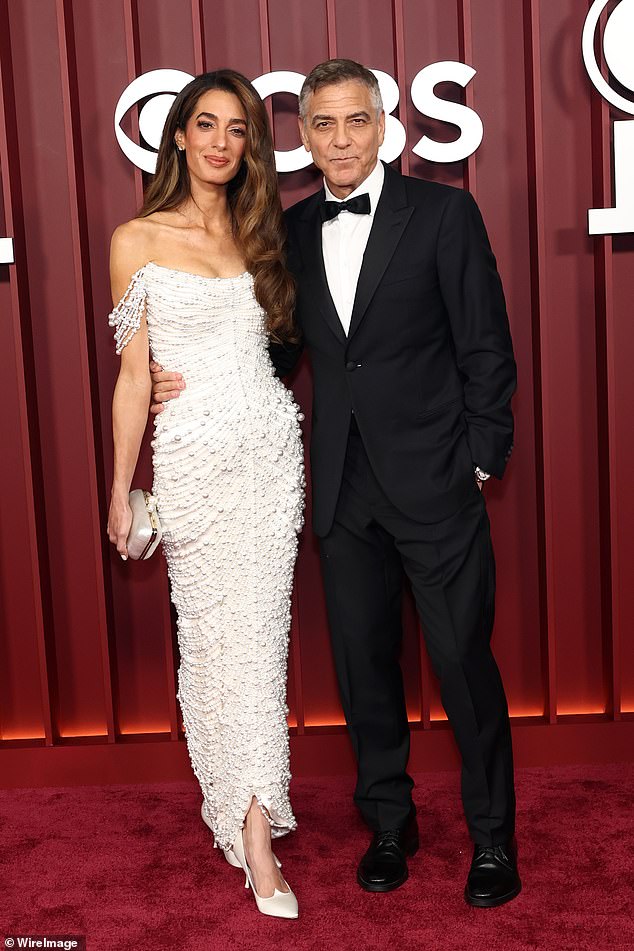 George Clooney is competing for his massively successful play Good Night, And Good Luck in the lead actor in a play category; pictured with wife Amal Clooney