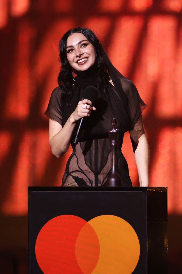 Charli XCX accepting an Album of the Year award.