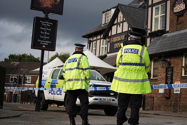 There is also a cordon outside the nearby Fairway Inn pub, with officers at the scene