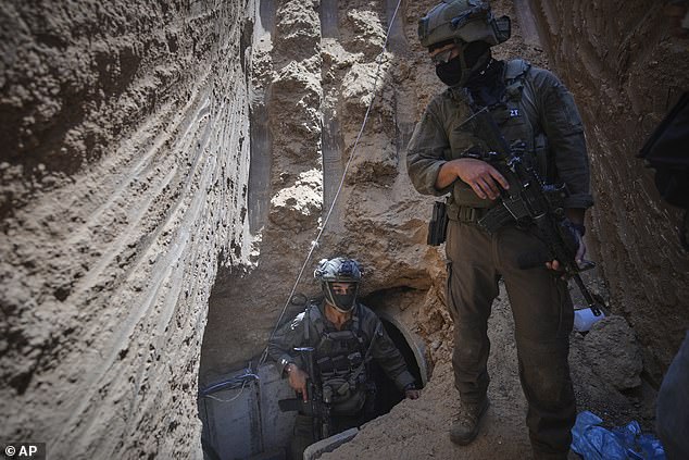 Israeli soldiers enter a tunnel beneath the European Hospital in Khan Younis, southern Gaza, where the military claims Hamas militants had been operating