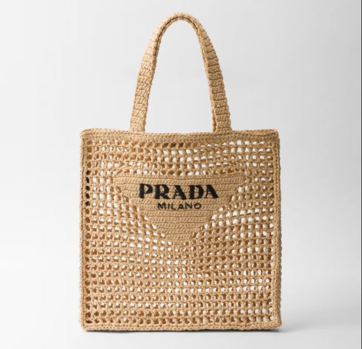 Crochet tote bag with Prada logo.