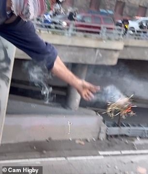 The demonstrator was trying to set the car alight