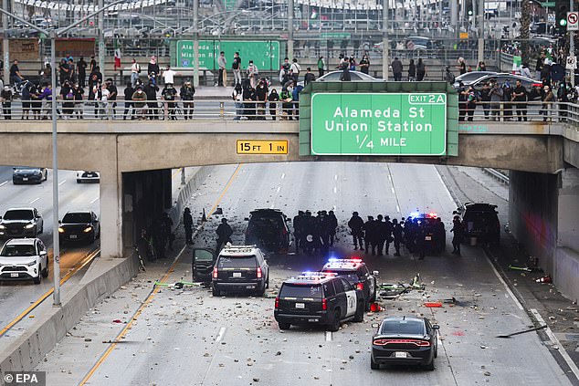 The protesters threw tinder lit on fire in an effort to blow up the police cars below, and attacked officers with rocks and tear gas from above when they made any effort to extinguish the flames