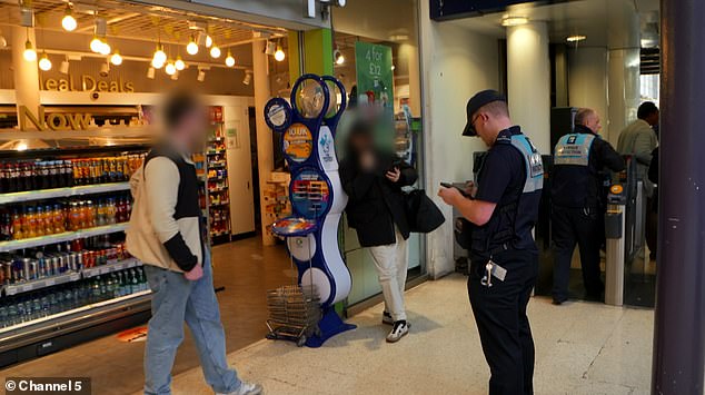 The man at Waterloo cannot present his money-saving railcard when asked by an officer