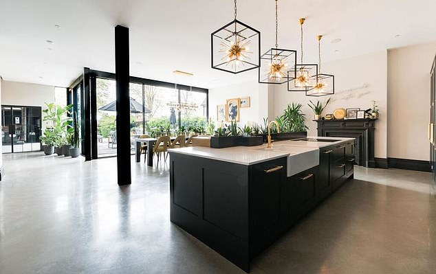 He has put the house - which has six bedrooms and six bathrooms - on the market for a whopping £2.75million. Pictured is the stunning open-plan kitchen area