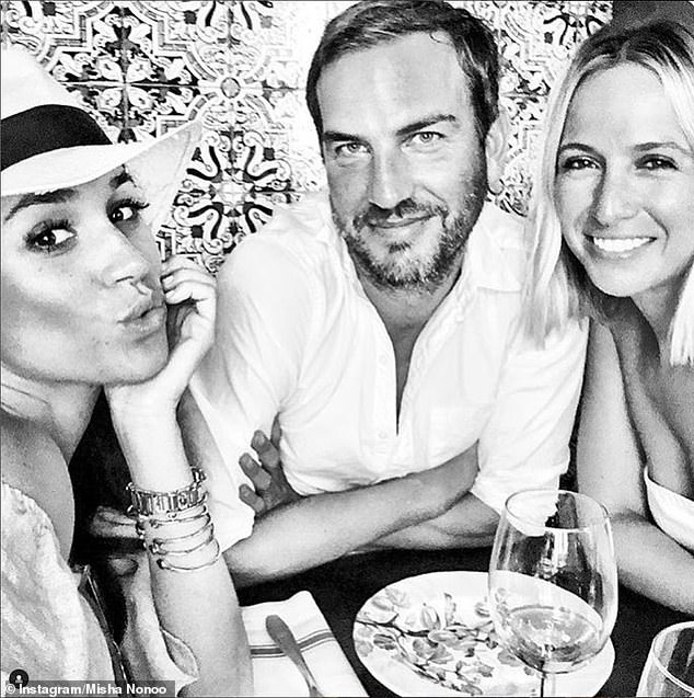 Markus is pictured with Meghan and her close friend Misha Nonoo
