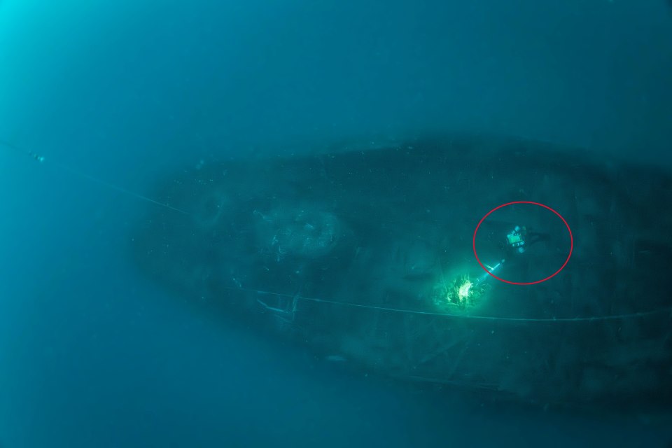 Divers exploring the wreck of the SS Nantes.