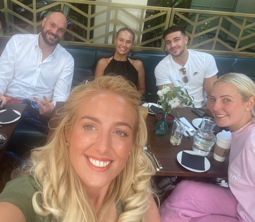 Group photo of Tyson Fury, Paris Fury, Molly Mae Hague, and Tommy Fury at a restaurant.