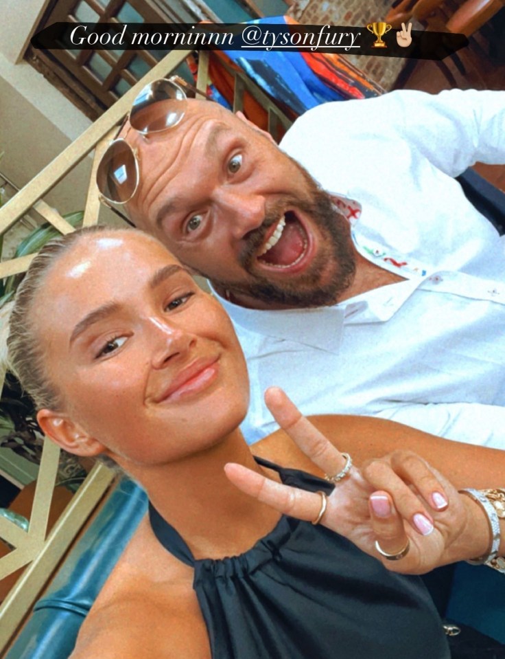 Tyson Fury and a woman smiling for a selfie.