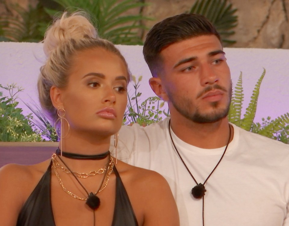 Molly-Mae and Tommy from Love Island sitting together.