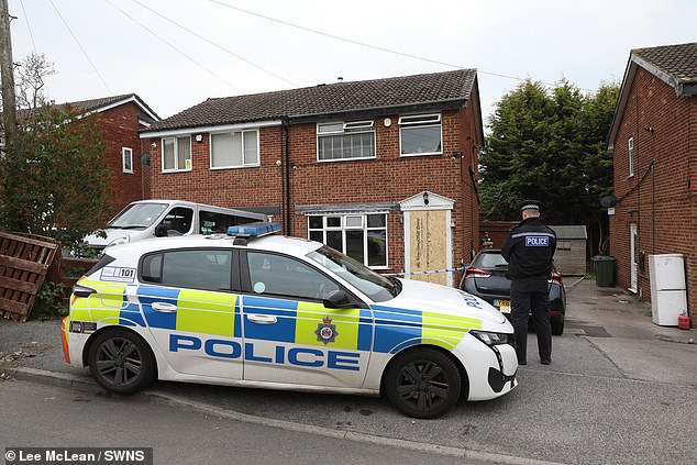 A two-storey semi-detached terrace house remains cordoned off while a blue tent was raised at the front of the property