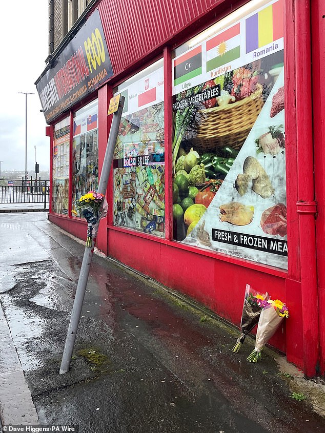Floral tributes left outside a shop in Westgate, Bradford, close to where Kulsuma Akter was stabbed to death on April 6, 2024
