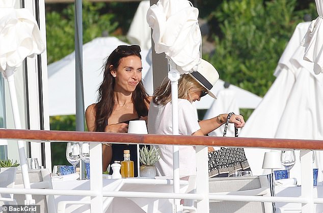 Christine fit right in at the swanky resort as she showed off her sophisticated sense of style in the navy look