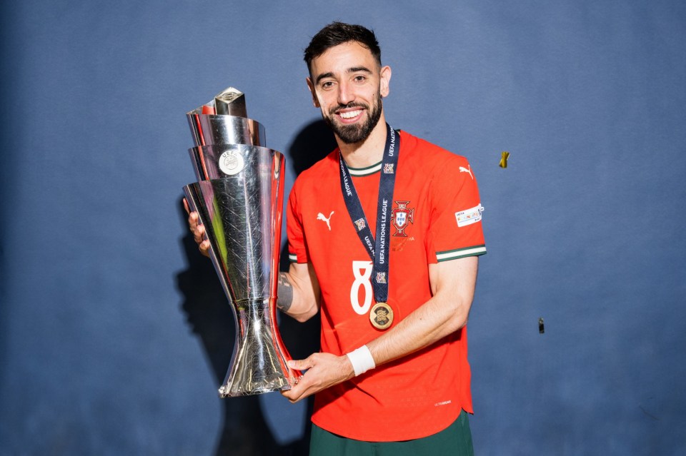 MUNICH, GERMANY - JUNE 08: Bruno Fernandes of Portugal poses for a photo with the UEFA Nations League trophy during the official UEFA Nations League 2025 Winners' shoot after the UEFA Nations League Final between Spain and Portugal at Munich Football Arena on June 08, 2025 in Munich, Germany. (Photo by Sebastian Widmann - UEFA/UEFA via Getty Images)