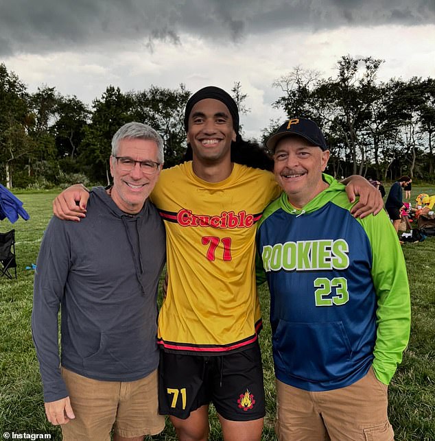 Pictured: Danny Stewart, left, and Pete Mercurio, far right, with their son, Kevin, who Stewart found abandoned as a newborn in a subway station in Manhattan