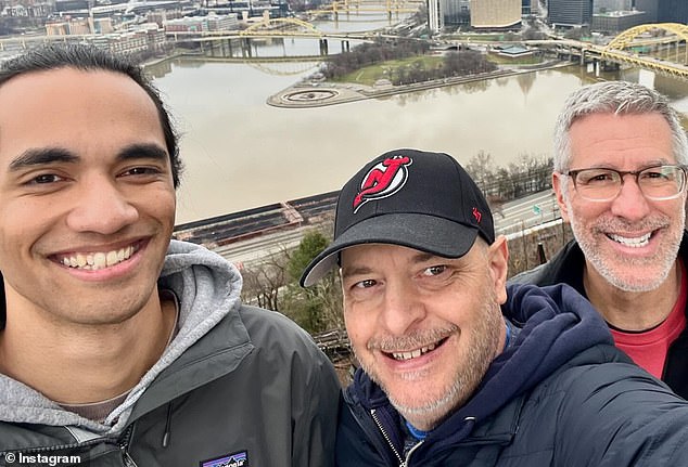 Pictured: Kevin, 24, with his dads, Mercurio (center) and Stewart today. ‘Mr. Stewart,’ the family court said at the adoption hearing in December 2000, ‘Would you be interested in adopting this baby?’